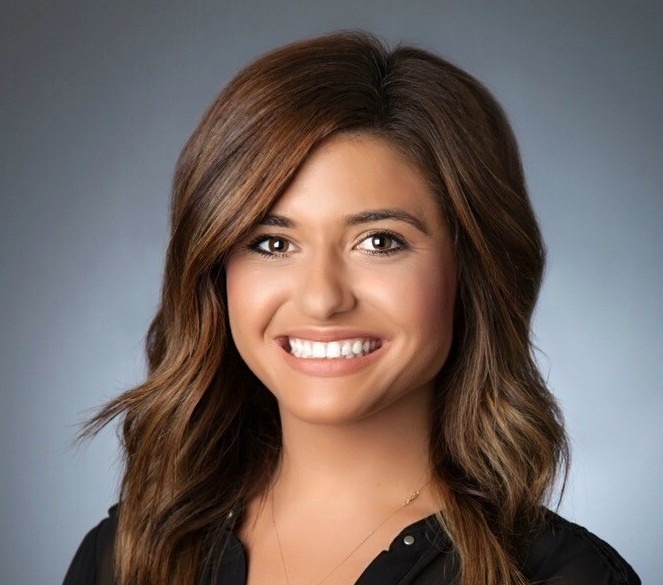 Dr. Megan Constant, DDS smiling in black dress