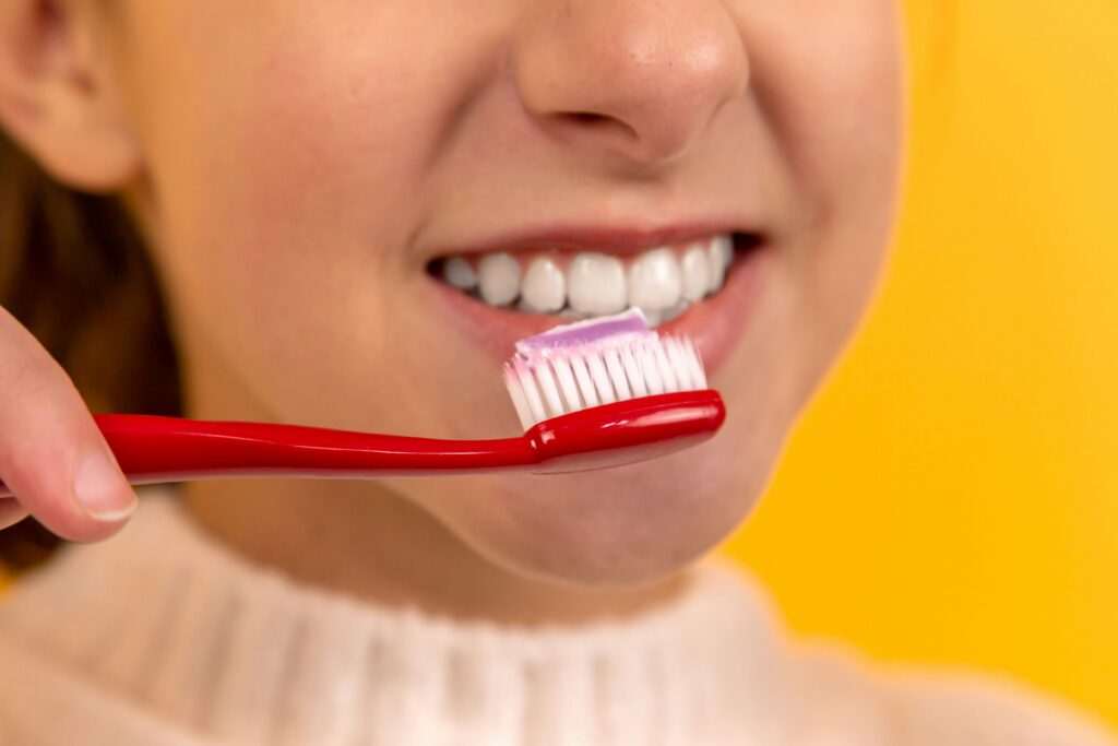 woman brushing her teeth