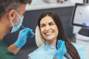 Woman getting routine dental exam