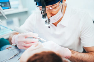 patient has root canal performed in dentist office